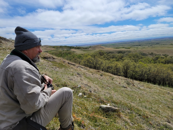 Delwin sitting on mountainside