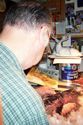 Don working on sculpture